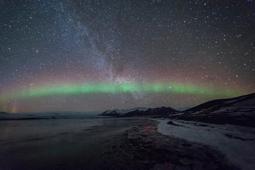 Aurora Borealis Over Frozen Lake — Photography Print. poster detail
