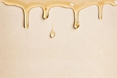 Beige background wallpaper dripping oil. poster print