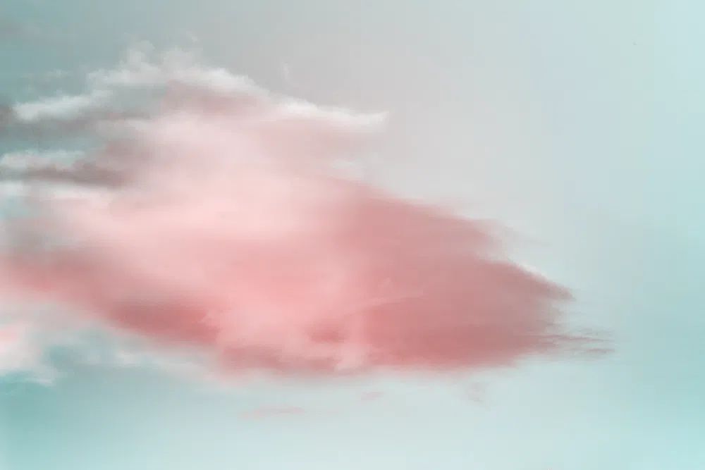 Blue sky soft pink clouds. poster detail
