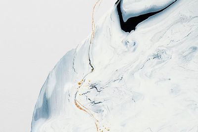 Abstract liquid marble white background.
