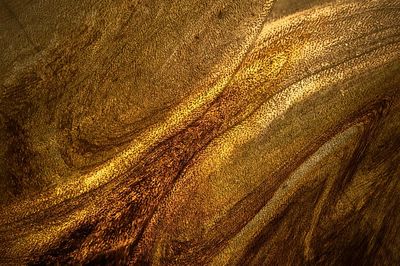 Dark gold paint textured background. poster