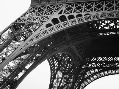 Bottom Eiffel Tower cloudy day. poster