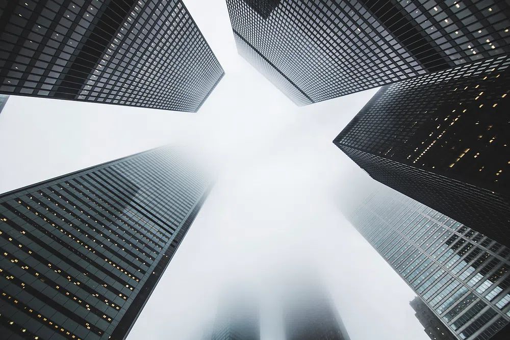 low-angle shot skyscrapers foggy day. poster — architecture art