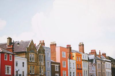 Assorted-color concrete row houses white.