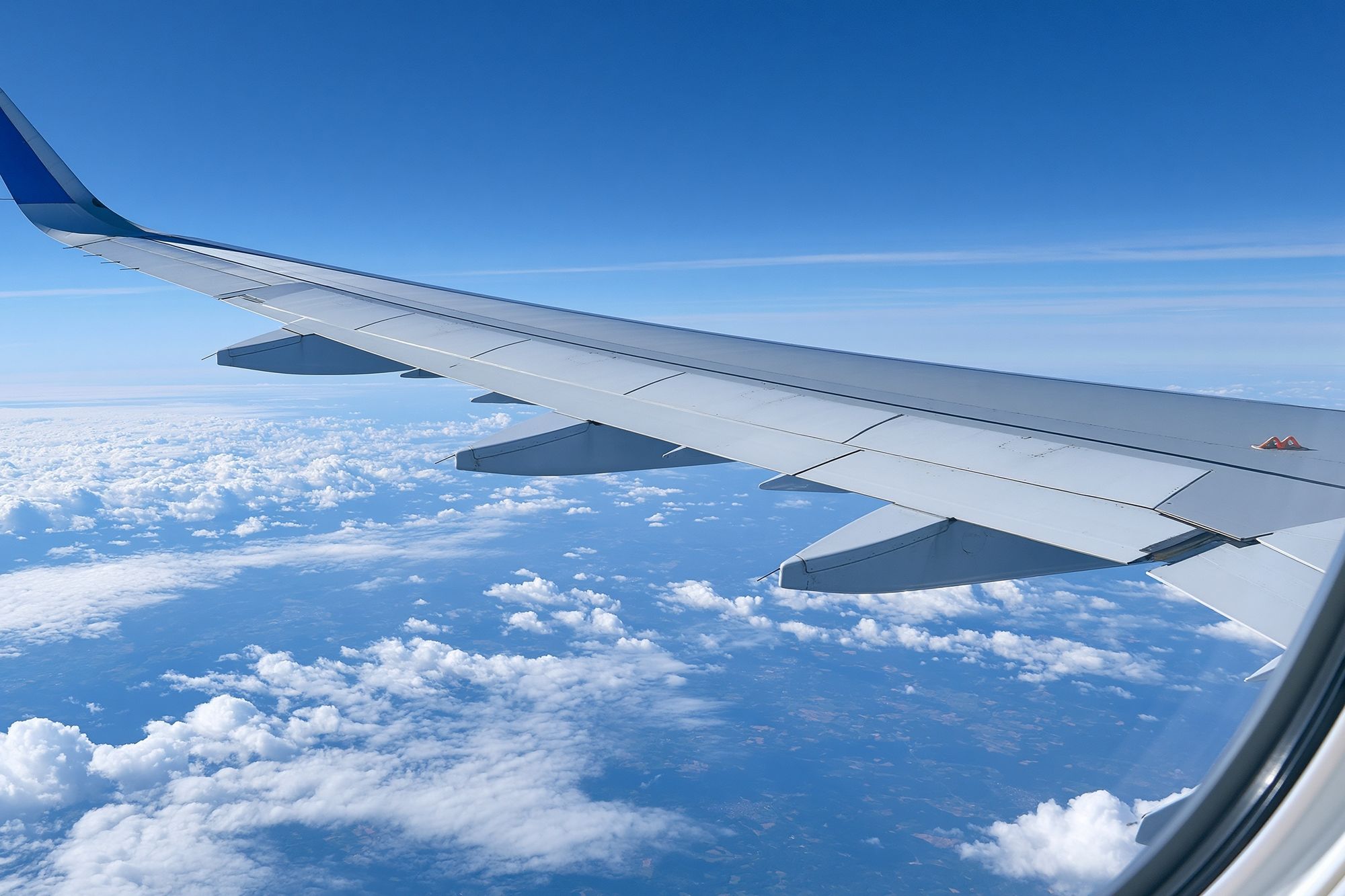 Airplane Wing Above Clouds Photography Poster. poster detail