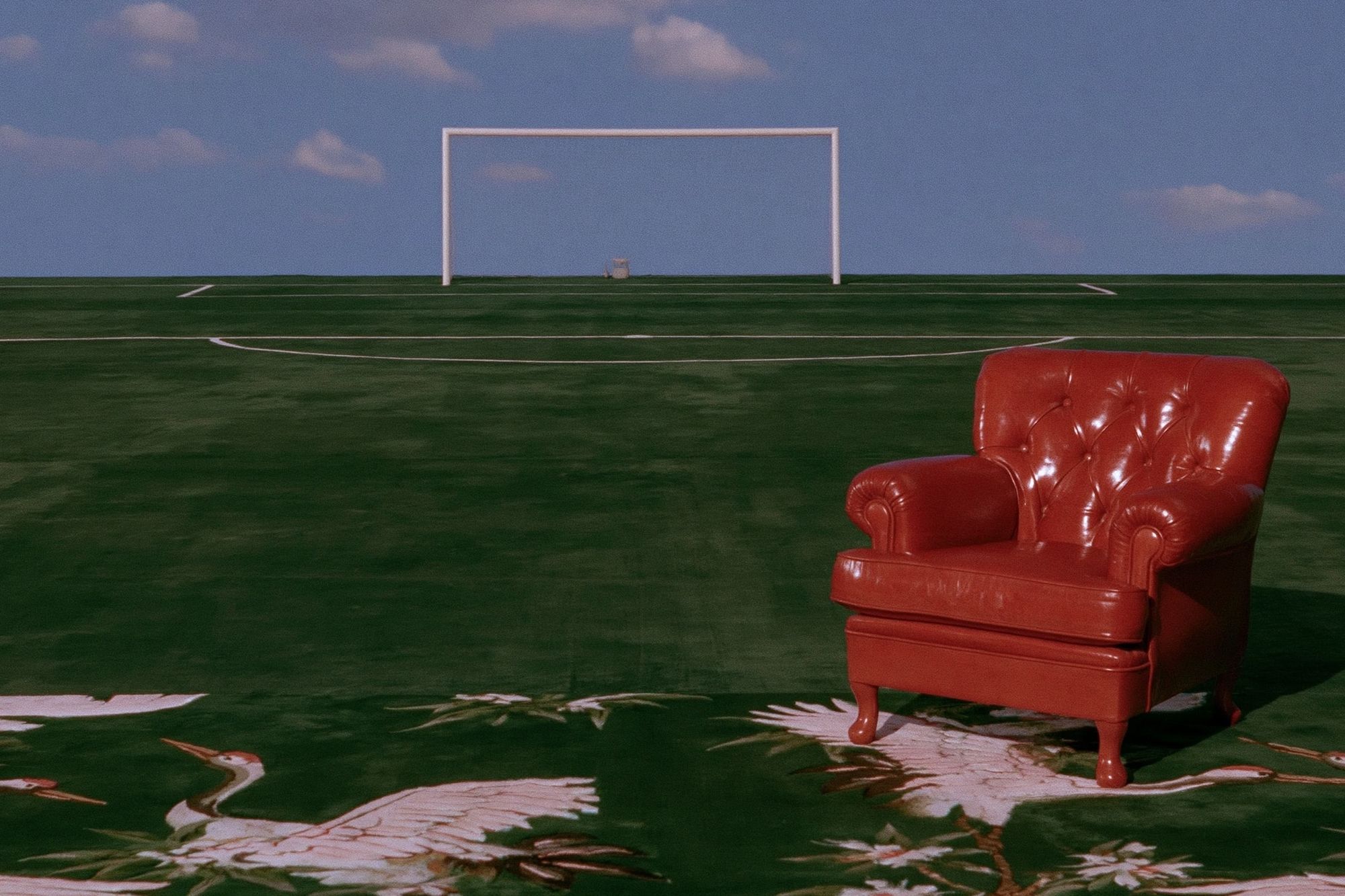 Red Armchair on Field Photography Poster. poster detail