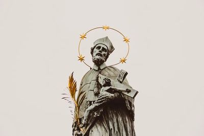 Stone statue saint crucifix gold. poster print