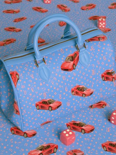 Blue Handbag and Red Cars Poster.