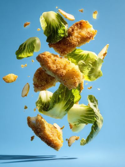 Floating Crispy Chicken Salad Poster. poster