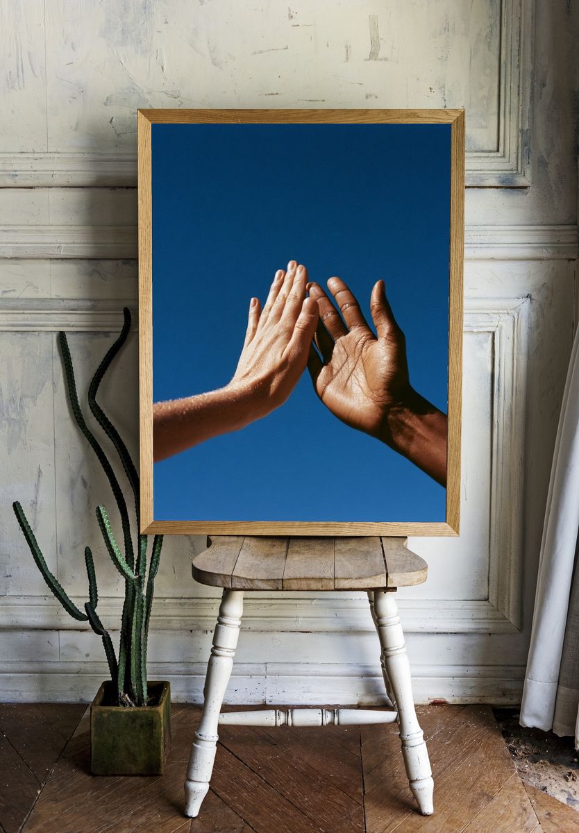Hands Against Blue Sky Photography Poster. — room view 1
