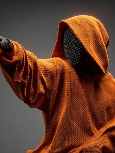 Orange Hooded Figure Digital Art Poster. poster