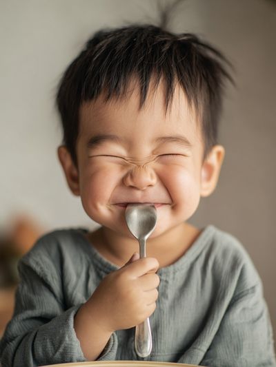 Happy Child with Spoon — Photography Print. poster print