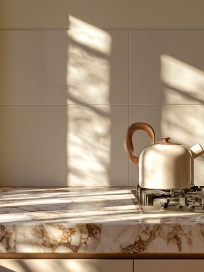 Sunlit Marble Kitchen Still Life Print. poster