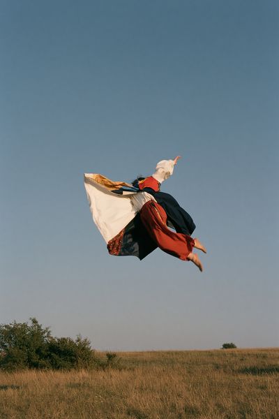 Leaping Figure in Sky Photography Poster.