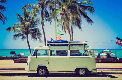 Classic caravan parked front beach. poster
