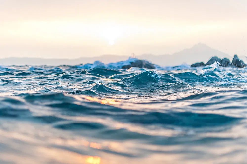 Ocean waves rippling Kavourotrypes Beach. poster detail