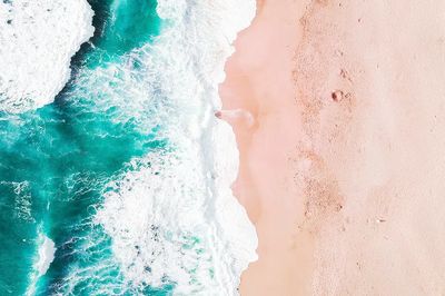 Aerial of Turquoise Ocean and Pink Sand Beach Poster.