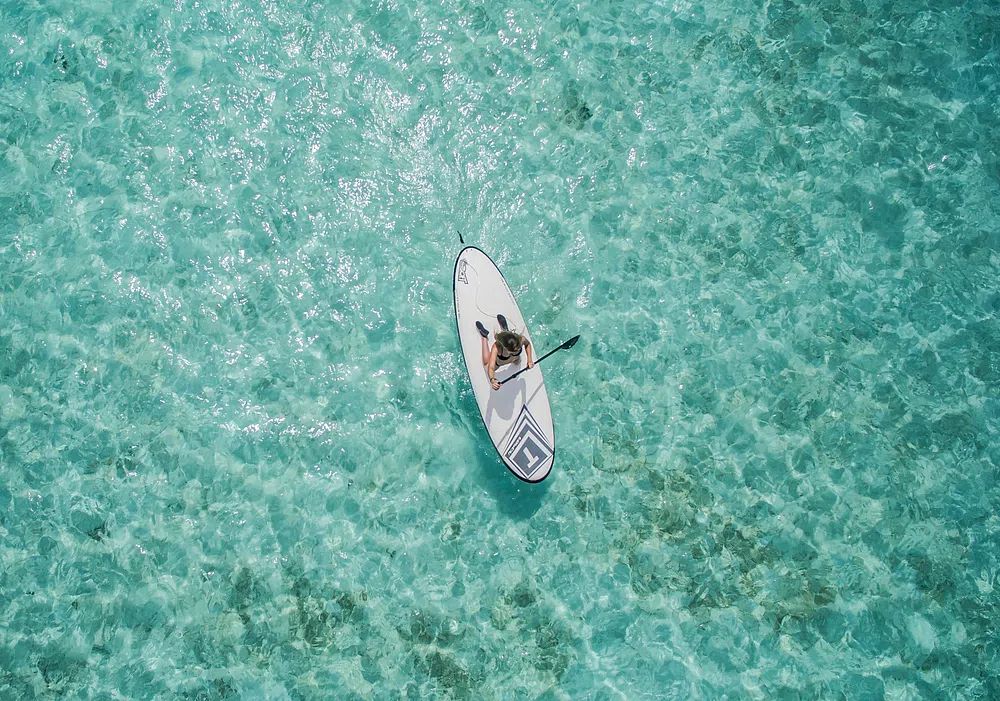 Paddleboarding in Crystal Clear Waters — Photography Print. poster detail