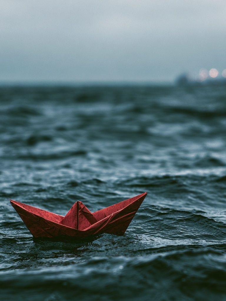 Red Paper Boat at Sea Photography Poster. poster detail