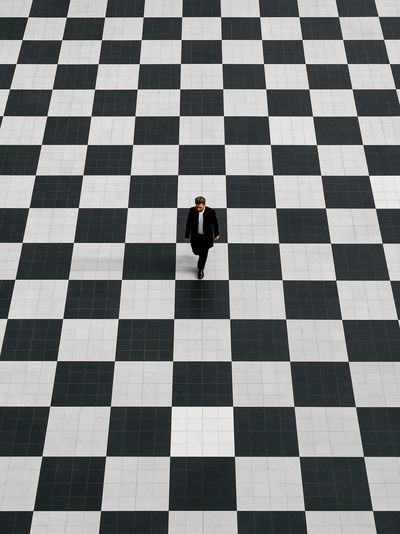 Solitary Walker Checkered Floor Poster. poster