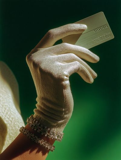 Gloved Hand with Credit Card Photography Poster. poster print