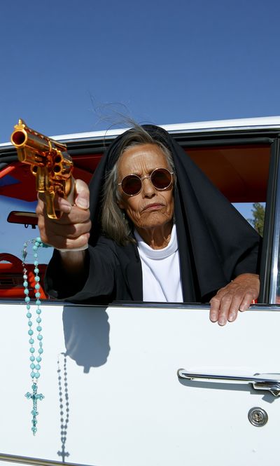 Nun with Revolver Photography Poster. poster print