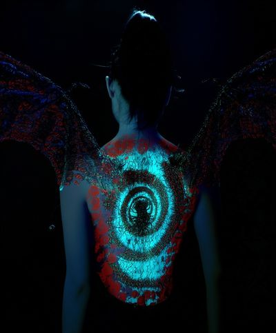 Neon Winged Figure Photography Poster. poster