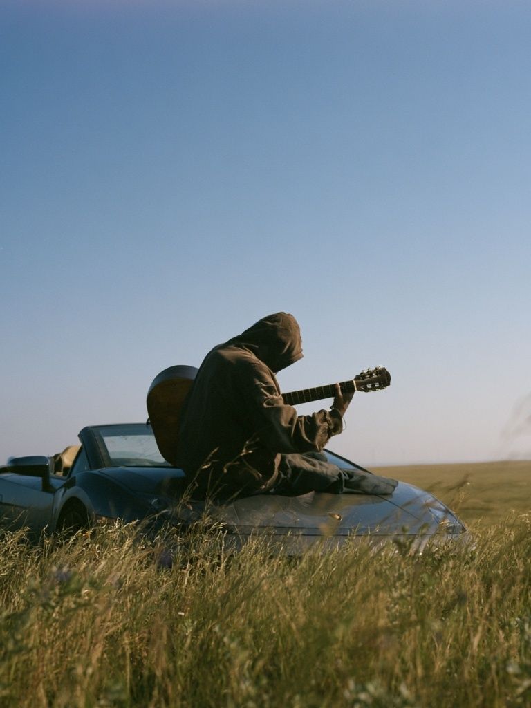 Guitarist in Field Photography Poster. poster detail