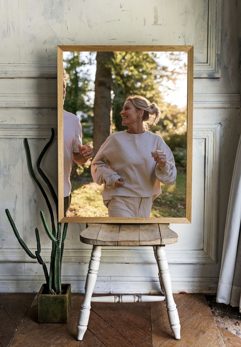 Couple Jogging in Sunlit Forest Photography Poster. room preview