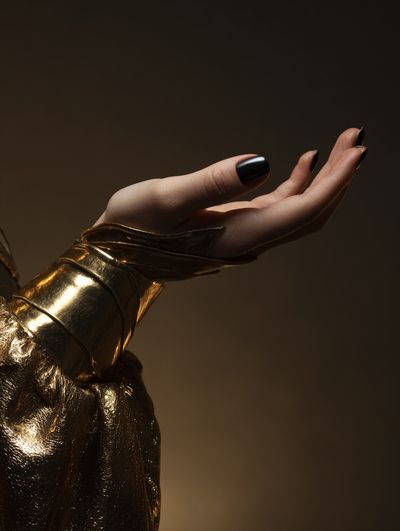 Golden Hand Gesture Photography Poster.