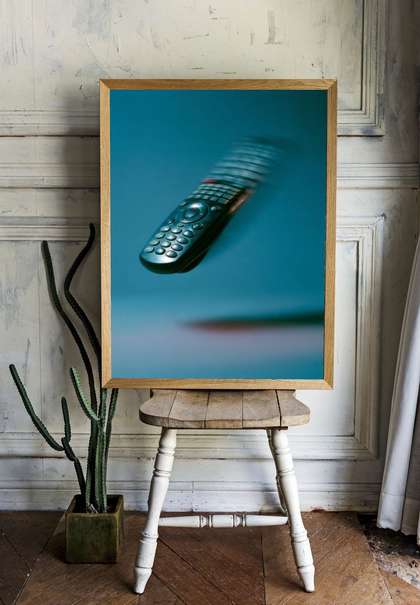 Floating Remote Control Photography Poster. room preview