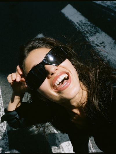 Smiling Woman in Sunglasses Photography Poster. poster print