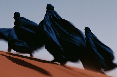 Desert Cloaked Figures Photography Poster.