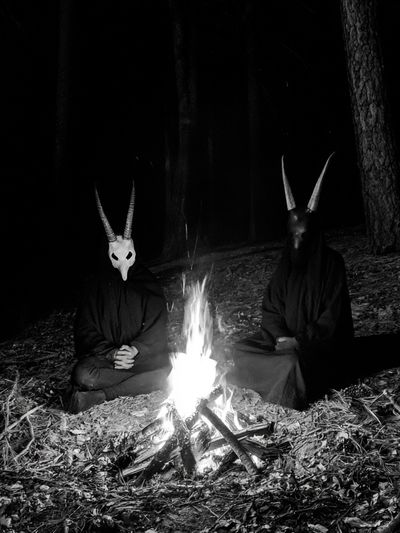 Horned Figures by Campfire Poster. poster