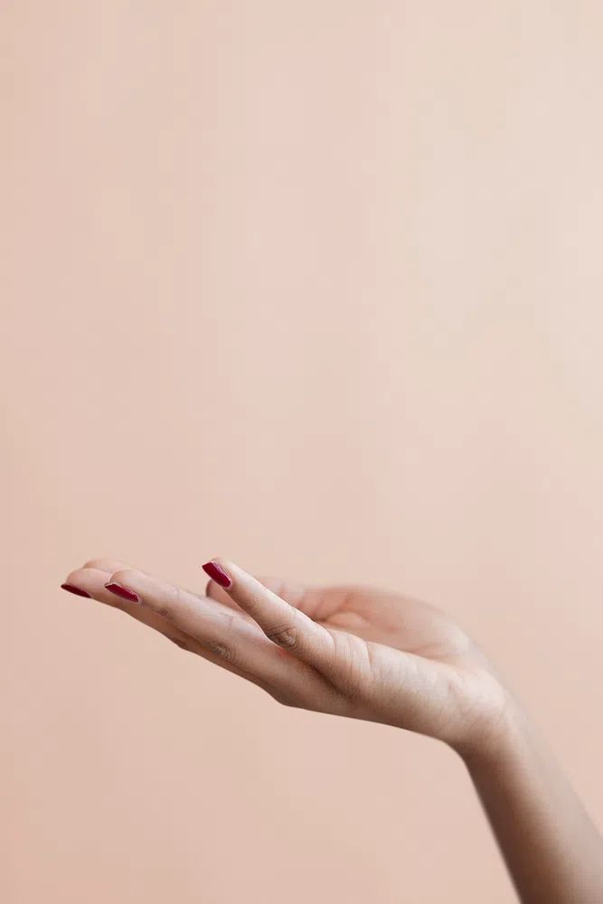 Female hand beige background. poster detail