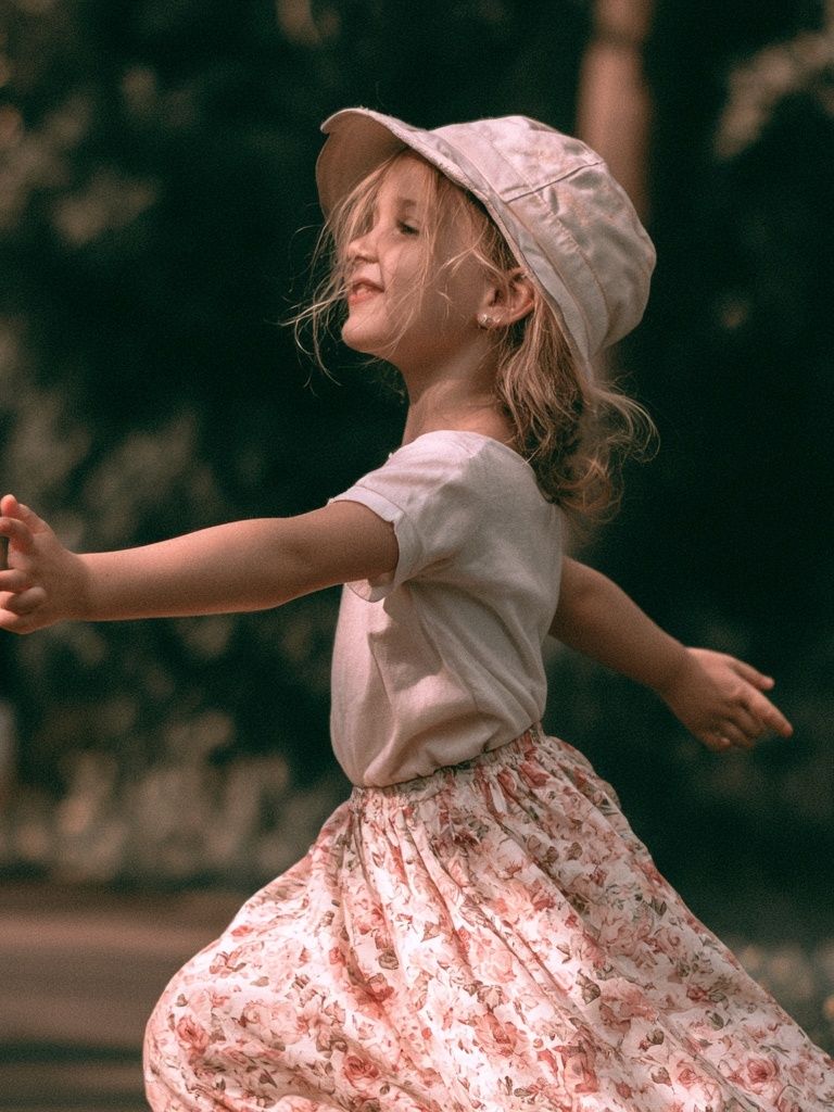 Joyful Child in Garden Photography Poster. poster detail