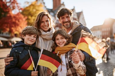 Happy Family with German Flags Photography Poster. poster