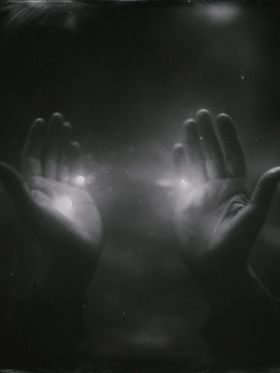 Hands in Light Photography Poster.