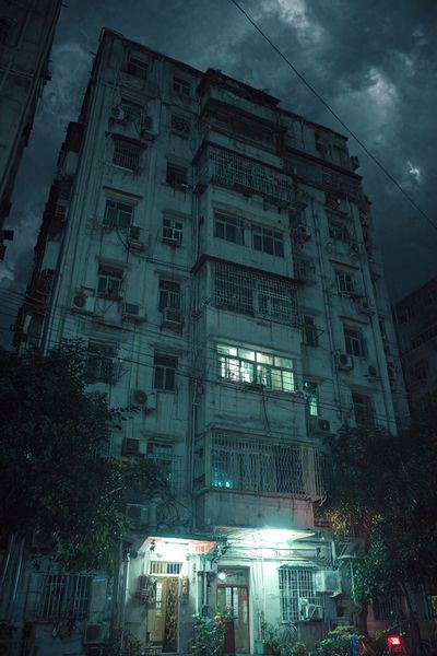 Rainy Apartment Block Night Poster. poster