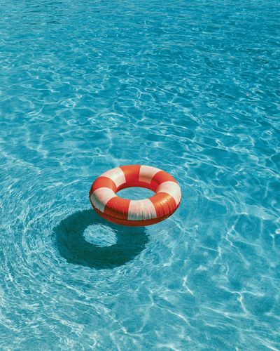 Lifebuoy in Blue Water Photography Poster.