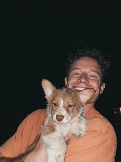 Smiling Man with Puppy Portrait Poster. poster