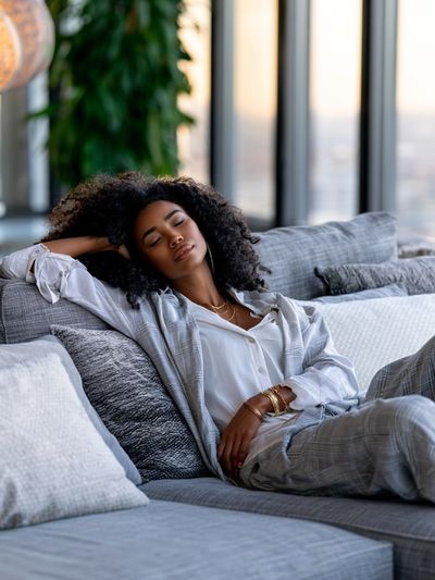 Relaxed Woman on Sofa Photography Poster.