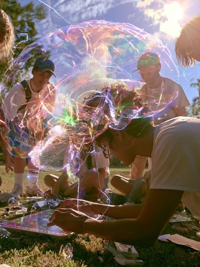 Sunlit Bubble Gathering Photography Poster. poster