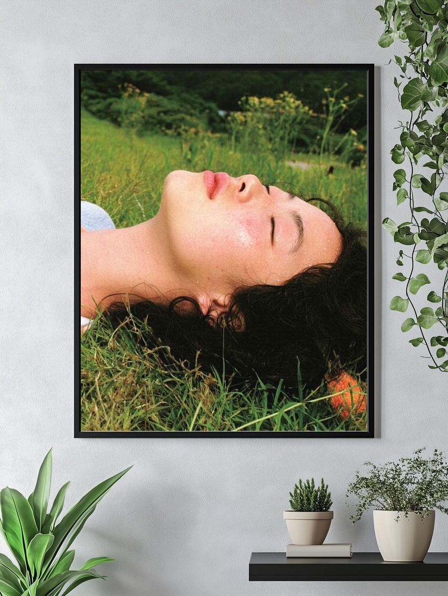 Woman Resting in Grass Photography Poster. — room view 4