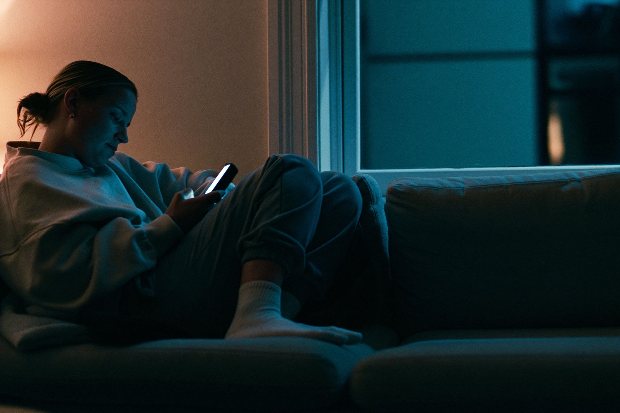 Cozy Evening Phone Glow Photography Poster. poster detail