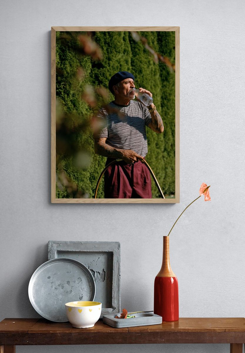 Man in Beret Drinking Water Poster. — room view 3