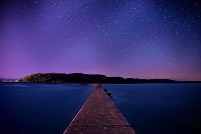 Starry Pier Nightscape Poster. poster