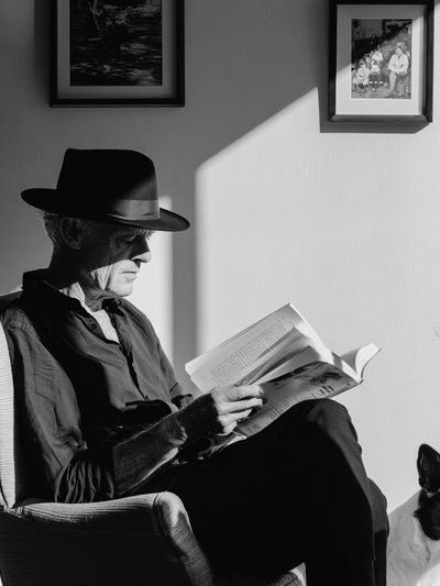 Man Reading with Dog Black-White Poster. poster print