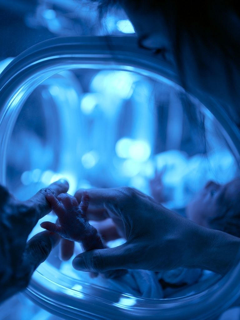 Newborn Hand in Incubator Photography Poster. poster detail