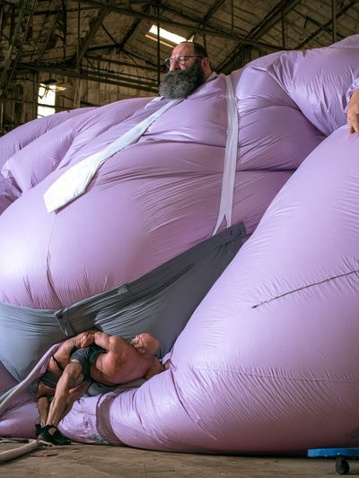 Inflatable Giant Figure Photography Poster. poster